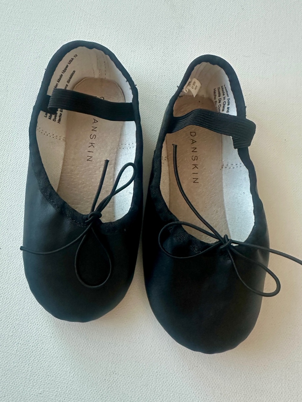Danskin girl’s Ballet Dance Shoes - Black.  Adjustable Elastic Strap.  Size 12.